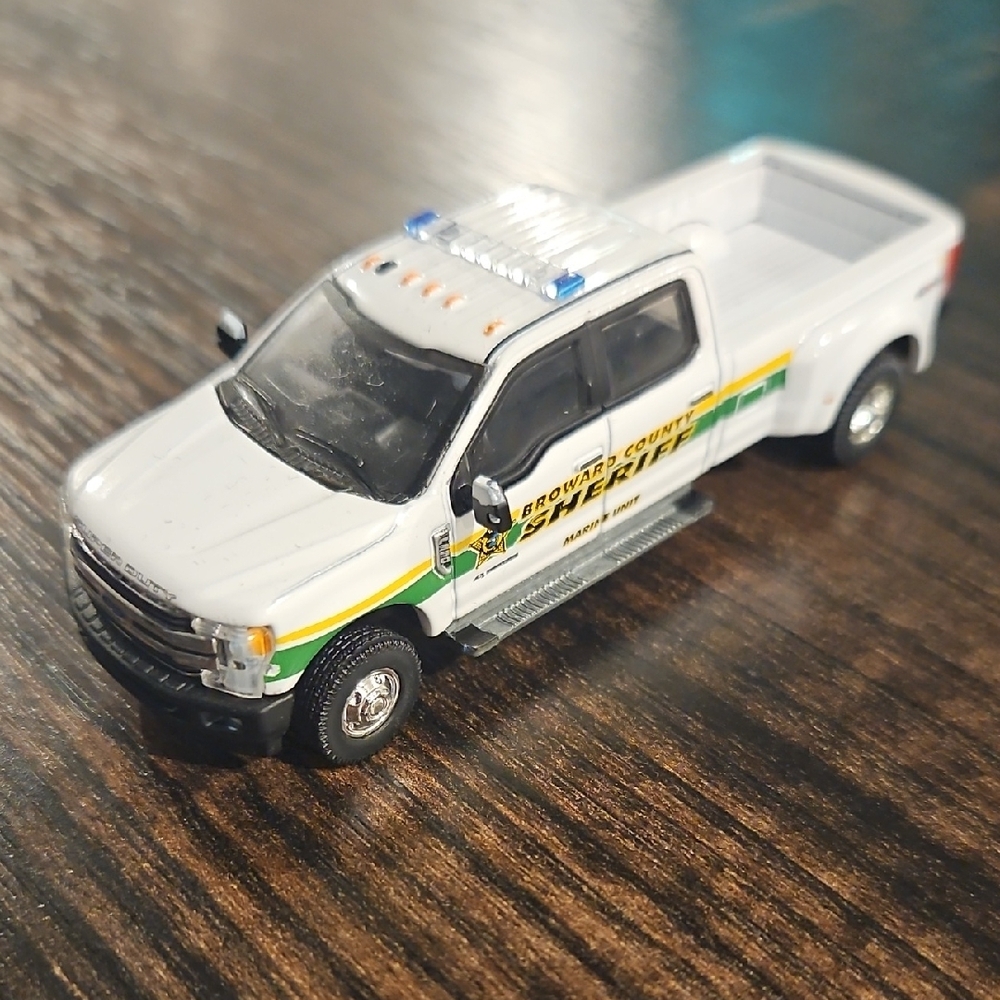White and Green Sheriff's Toy Truck